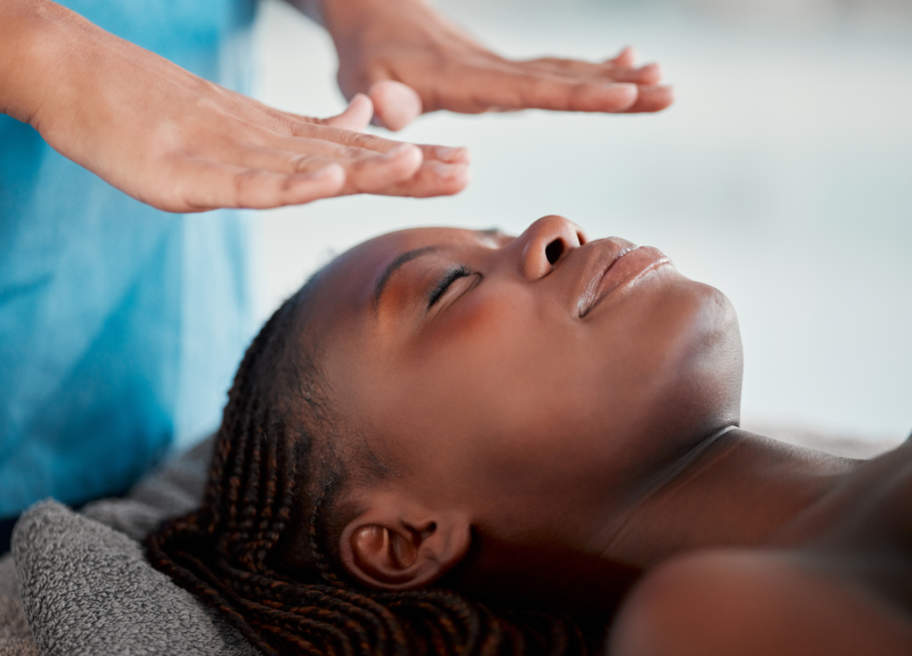Black woman, reiki massage and luxury spa treatment of a young female ready for salon facial. Skinc.